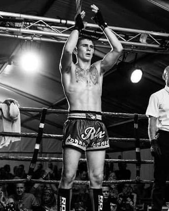 Irvidas Juškys raising his arms in the ring after a K1 fight