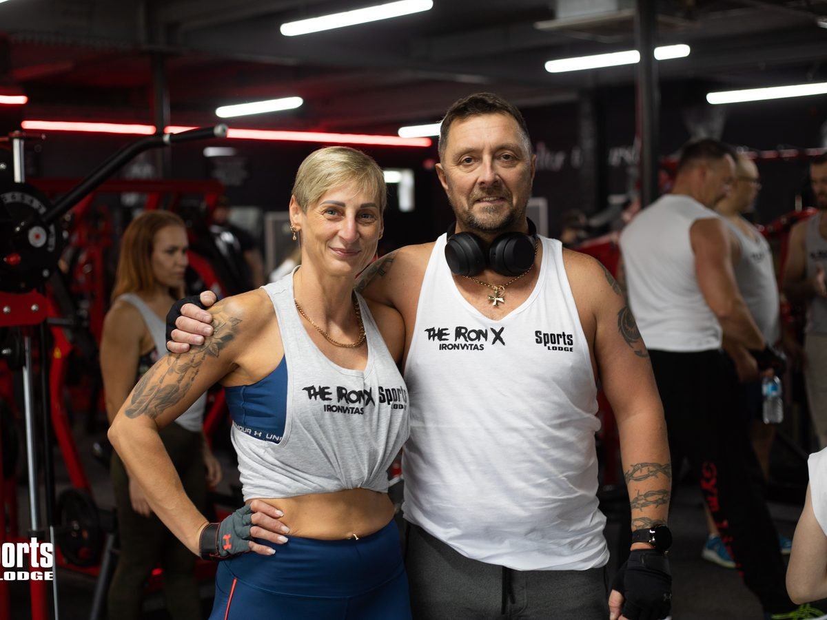 Two Sports Lodge members standing together in a gym